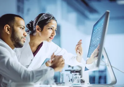 Scientists working on a computer in a laboratory